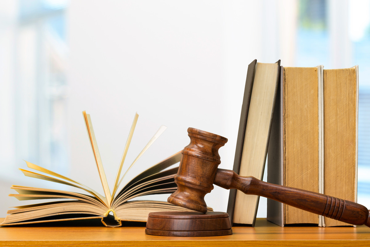 Open law book with a gavel and medical symbols, illustrating what is the statute of limitation on medical malpractice. This image highlights the legal aspect of medical malpractice cases and the importance of understanding time limits