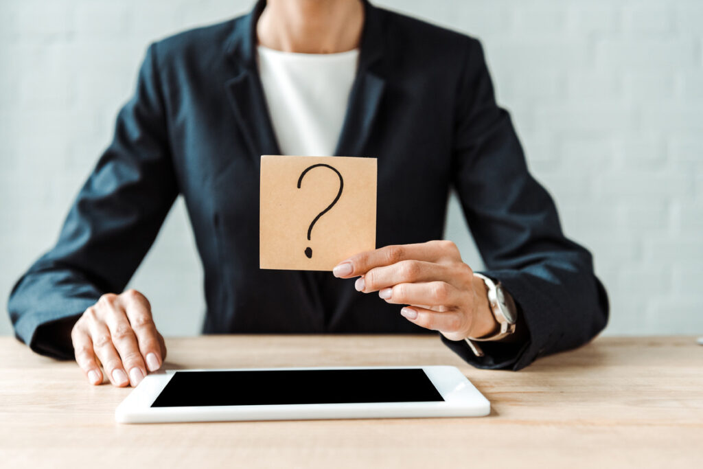woman holding a question mark symbolizing questions on collaborative divorce