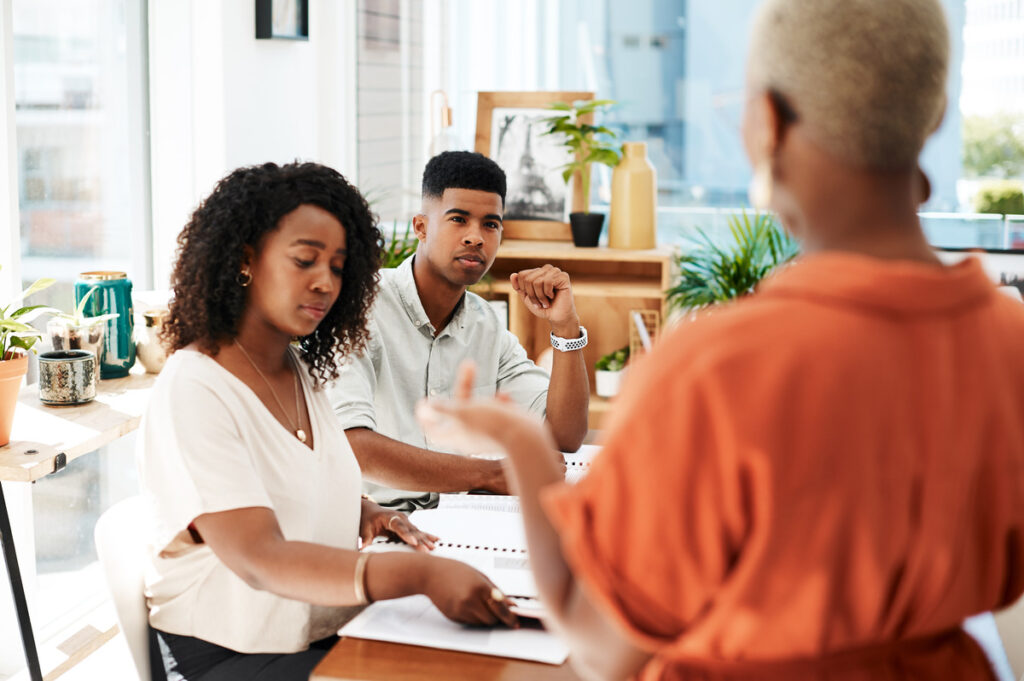 Couple asking a lawyer if collaborative divorce is right for them