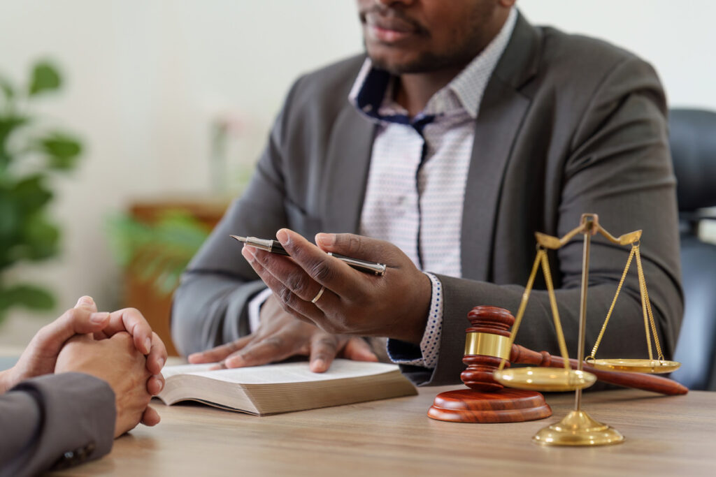 A family law lawyer in Houston consults with a client in a professional office setting