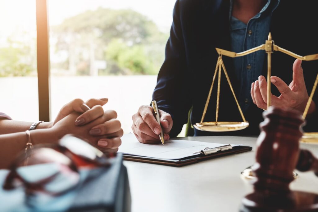 A lawyer consults with a client, discussing the nuances of medical malpractice versus general negligence