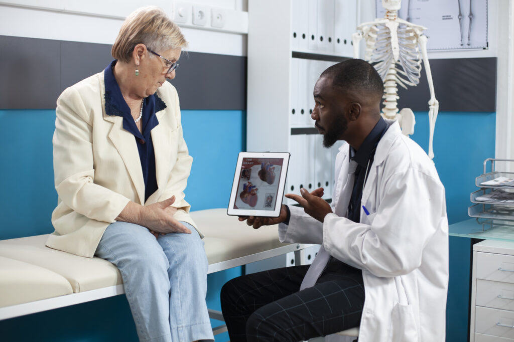 doctor explains diagnosis through a tablet