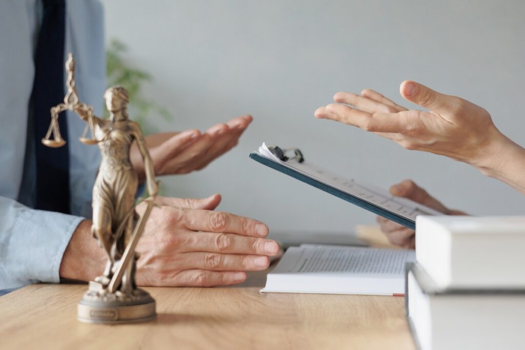 A lawyer discussing medical malpractice claims to a client