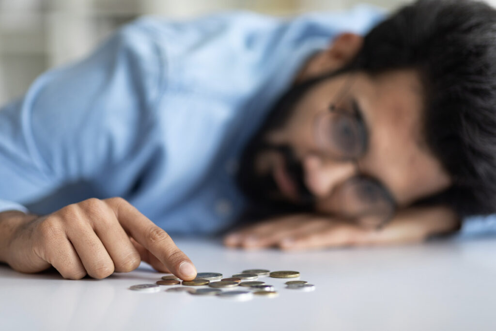 A person counting coins