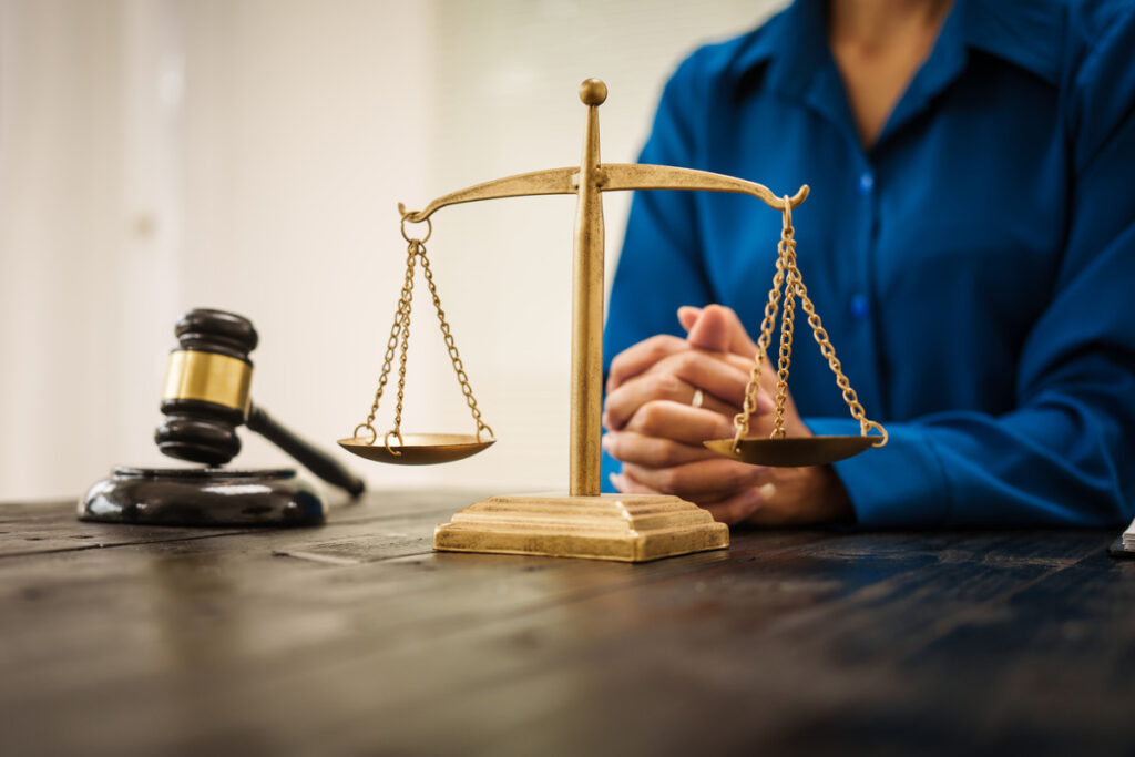 a gavel and scales of justice on a lawyer's table