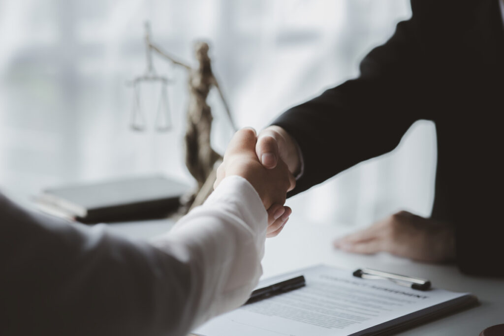 lawyer shaking hands with a client