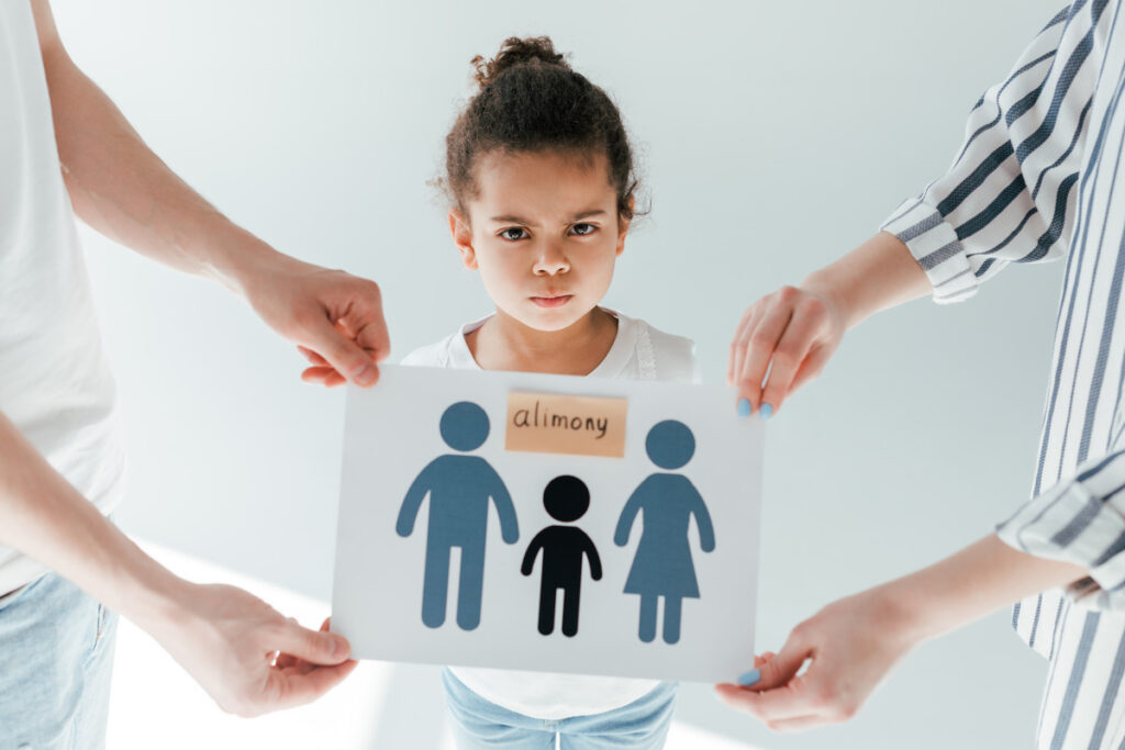 Portrait of a family with the word Alimony on a Paper Doll