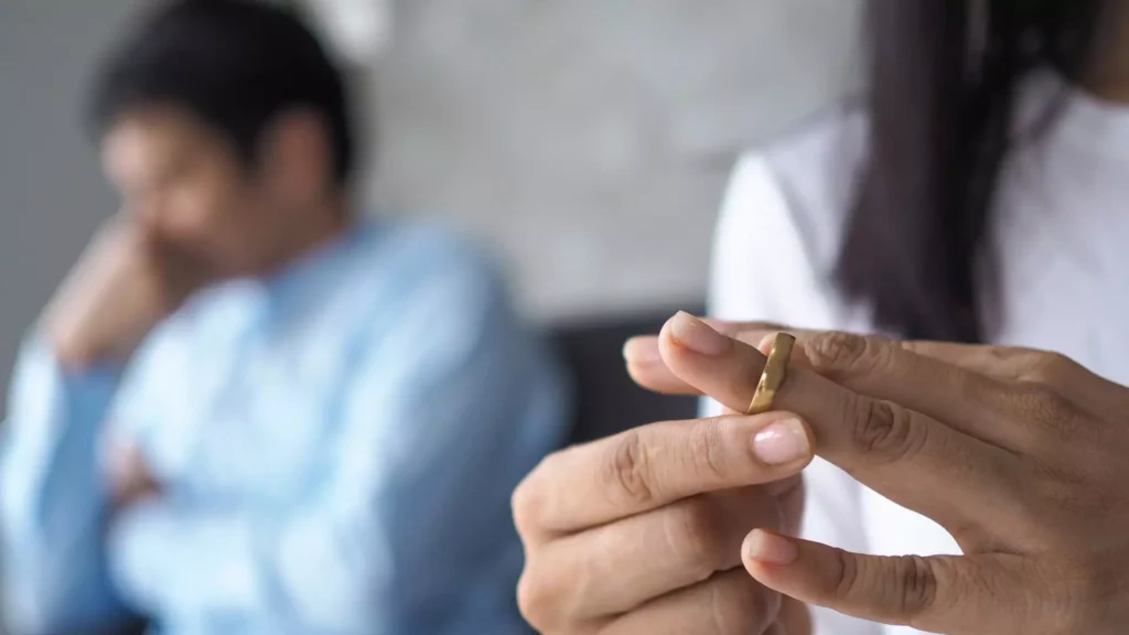 a wife taking off her ring