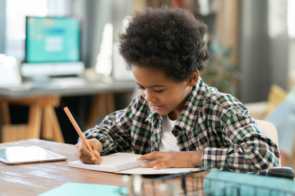 A child enjoying their homework