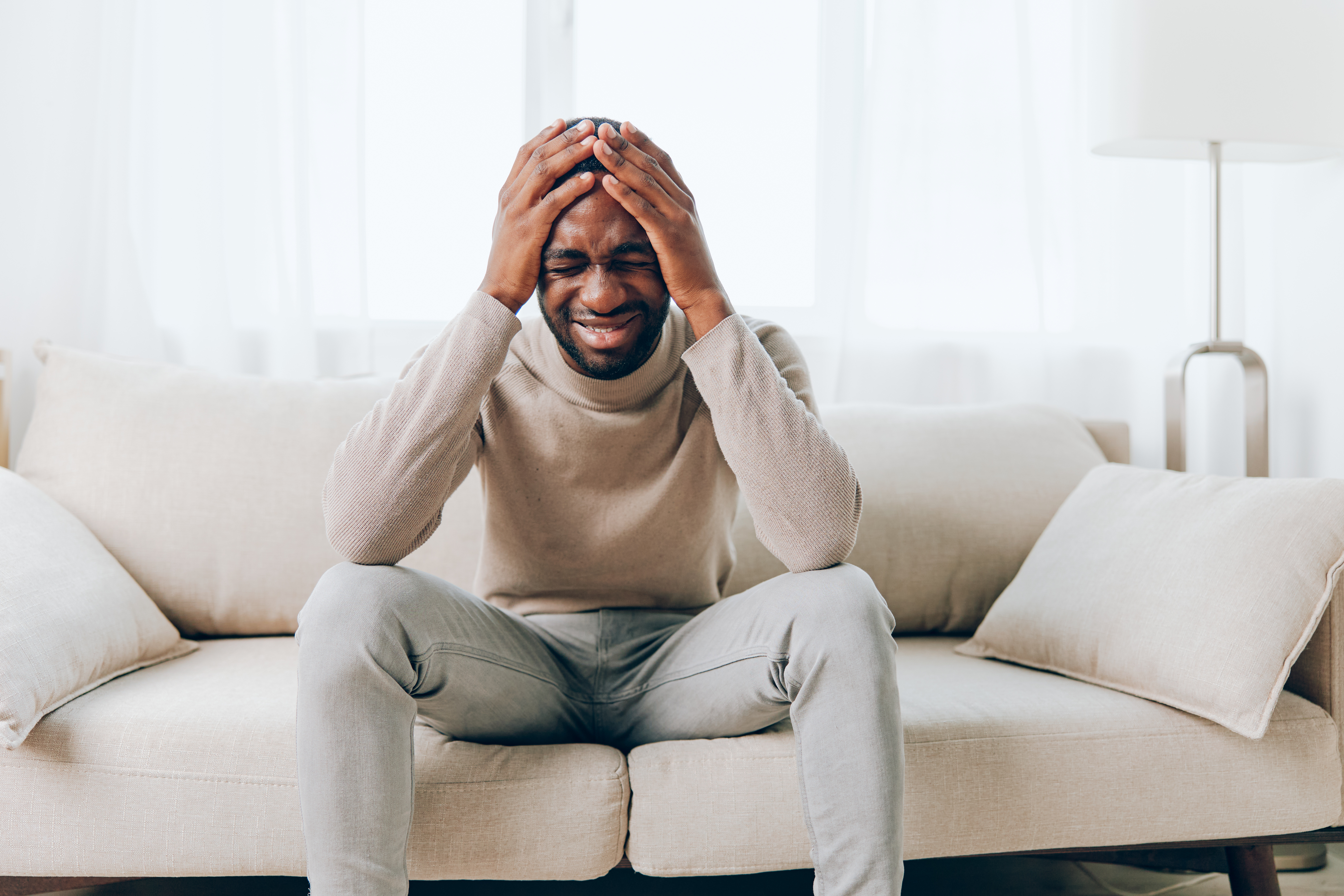 a stressed out man thinking about the earlier car accident